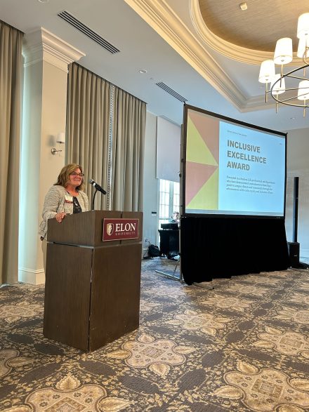 Eleanor Finger, assistant vice president for student Life, dean of campus life and assistant professor presenting the Innovation Award at the End-of-Year Student Life Luncheon on May 1, 2024. 