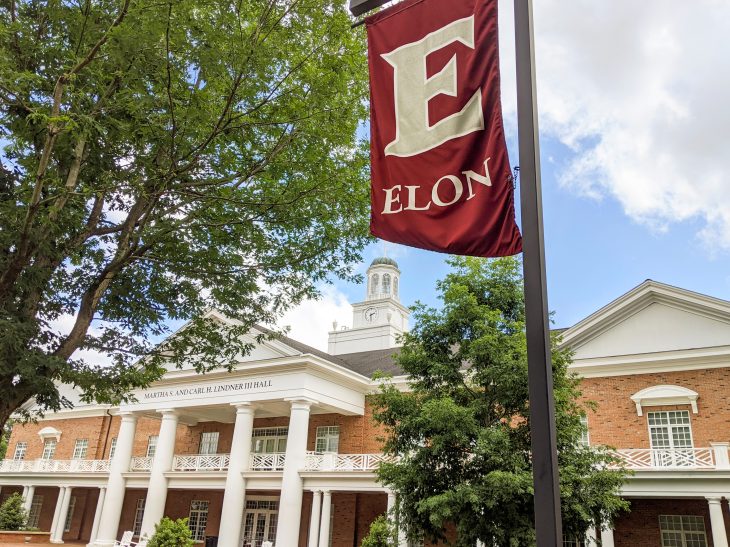 Lindner Hall with an Elon University banner