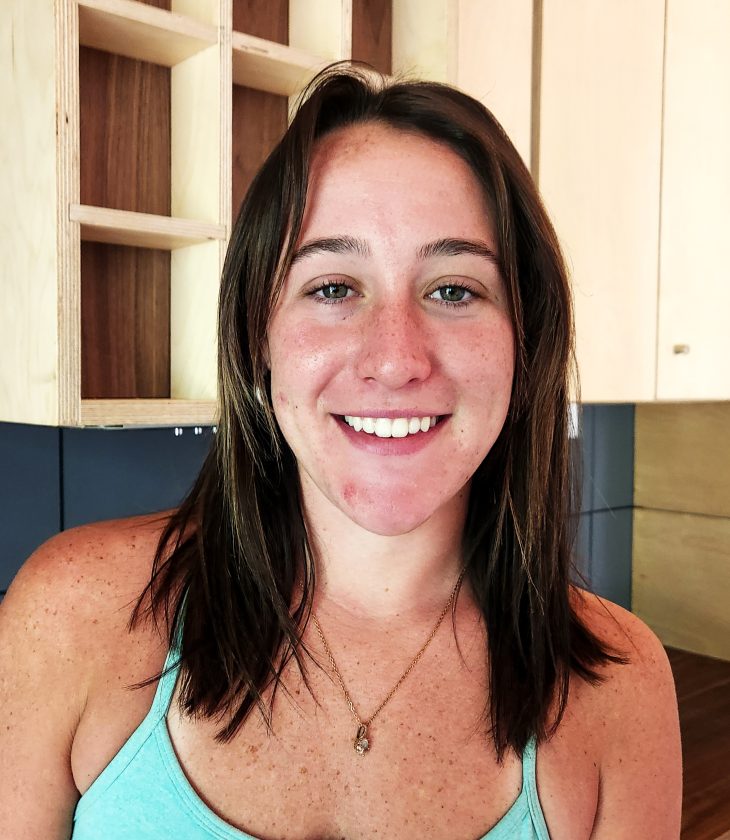 headshot of a woman inside home