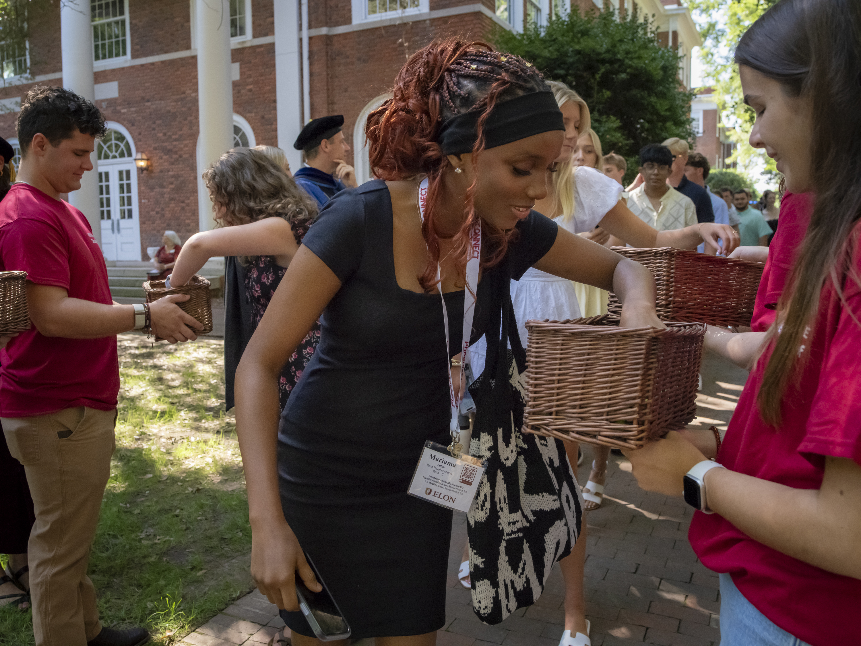 Student picks an acorn