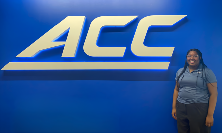 Christian Atwater in front of ACC sign