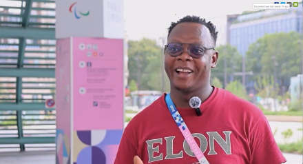 Screen shot of a man in an Elon shirt. 