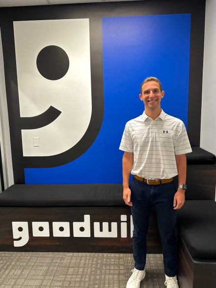 Jack Halpern '25 in front of the Goodwill sign