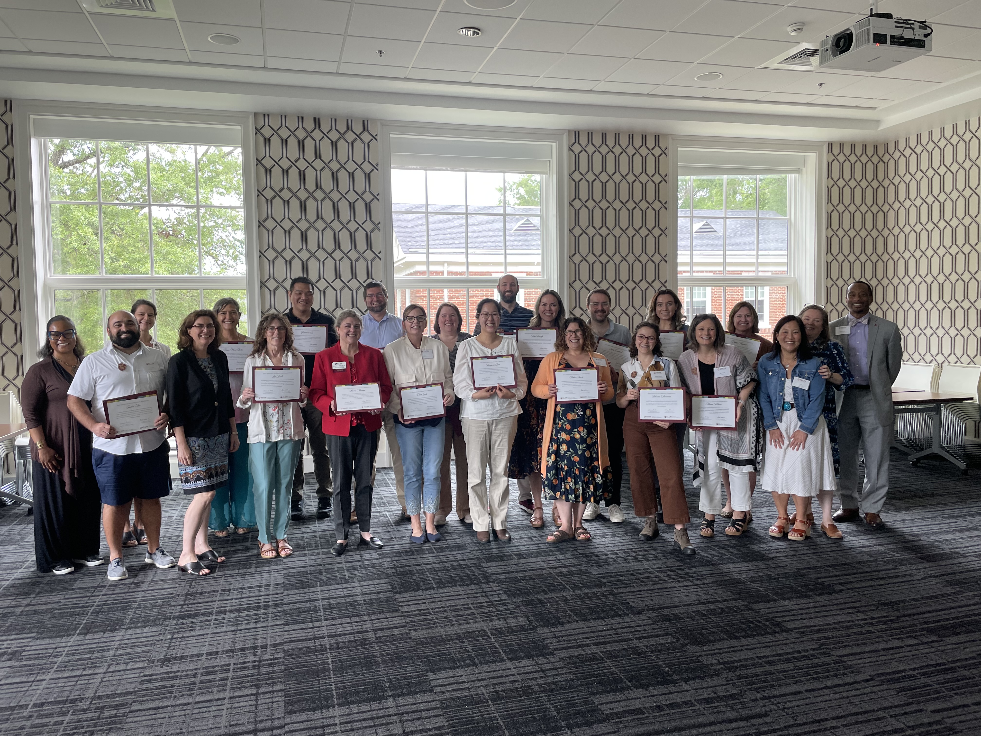 Group of people hold certificates