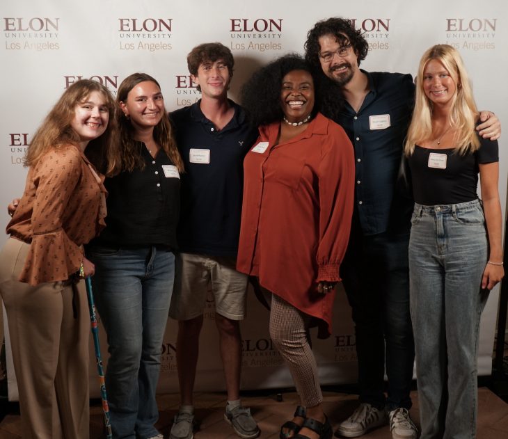 Six people pose for photo