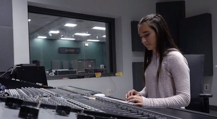 Nicole Bazos works on a mixing board