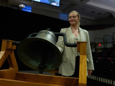 Student rings large bell