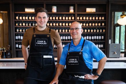 Two people stand in aprons