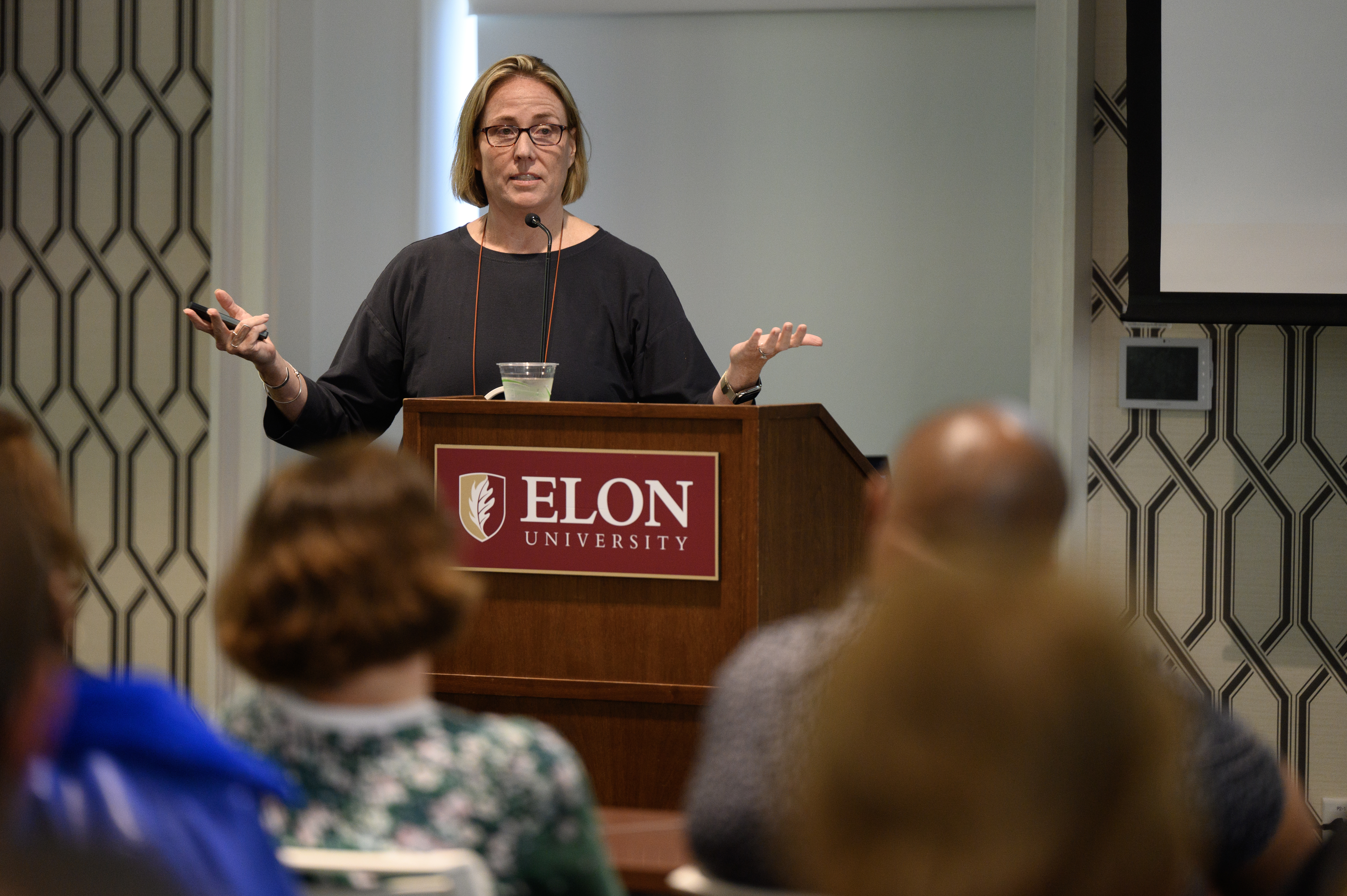 Caroline Ketcham speaks at a podium