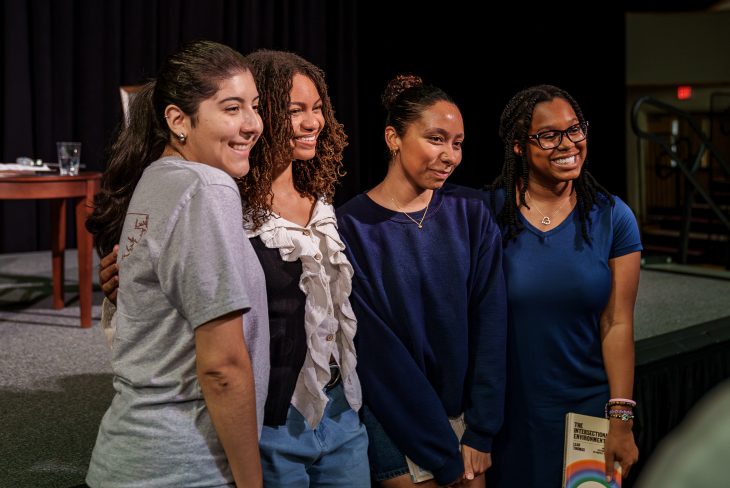 Students pose for photo with Leah Thomas