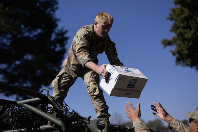 U.S. Army official hands box down