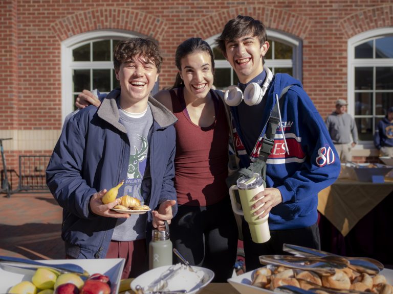 Three students pose during College Coffee