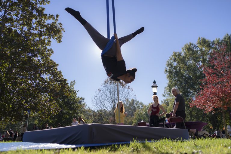 An aerialist uses silks during HealthEU Day