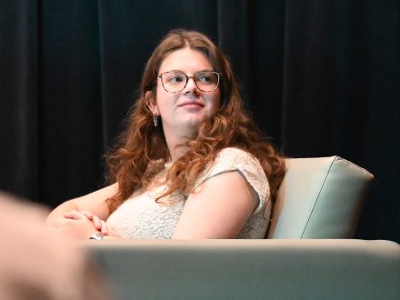 Avery Sloan sits in Elon's Jane and Brian Williams Studio.