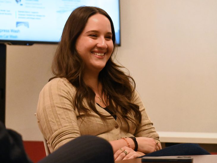 Maria Ramirez Uribe ’20, an immigration reporter and fact-checker for PolitiFact, smiles while addressing students in Assistant Professor of Journalism Israel Balderas' Politics and Media class on Oct. 22 in Schar Hall. Ramirez Uribe visited campus to participate in an alumni speaker series heading into the 2024 Election.