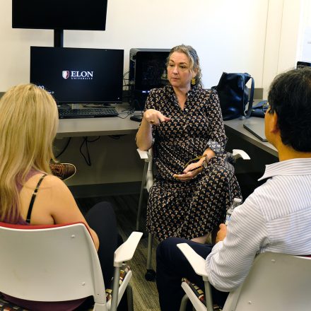 Shannon Zenner, elon professor, talks with students.