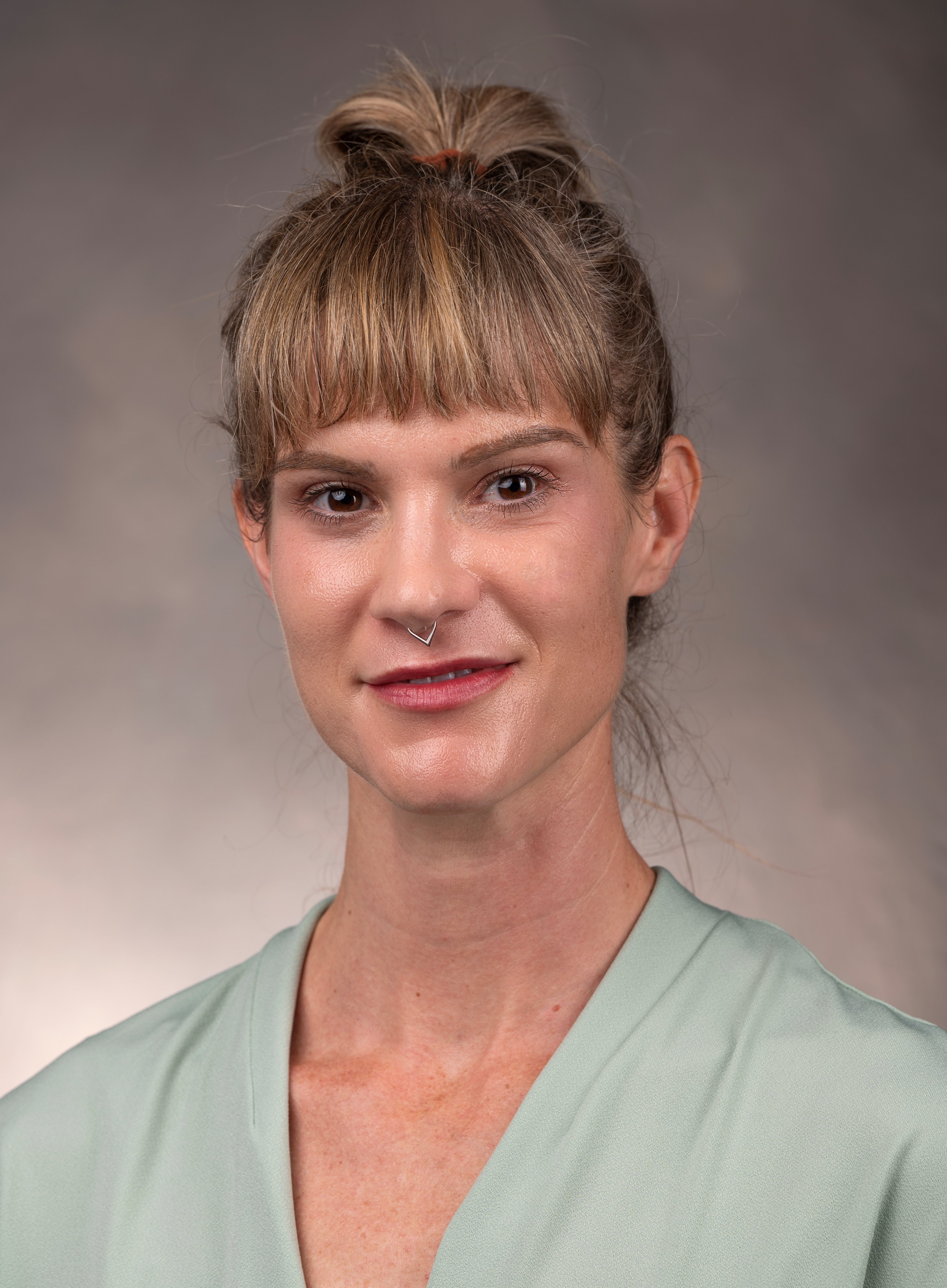 directory portrait of Renay Aumiller in green dress