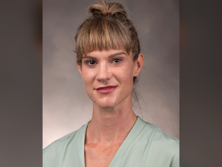 directory portrait of Renay Aumiller in green dress