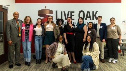 Kenn Gaither (left), dean of the School of Communications, poses with professionals representing McKinney, Pace Communications and APCO Worldwide. 