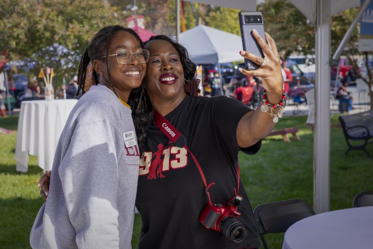 Two people take a selfie