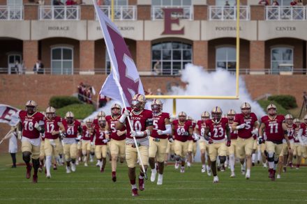 Elon football team runs