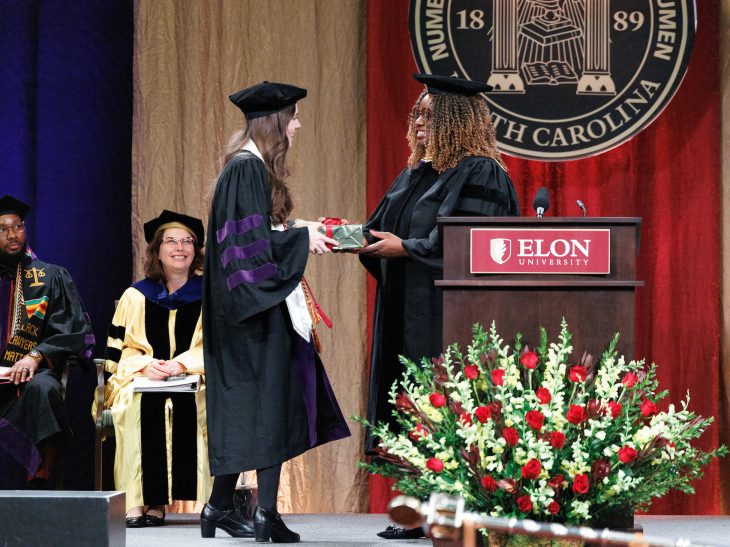 Ashley Joines L'24 is presented the David Gergen Award for Leadership & Professionalism by Assistant Professor Rosa Newman-Ruffin during Elon Law Commencement exercises for the Class of 2024.