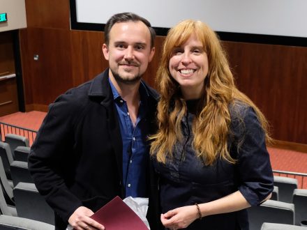 Elon alumnus Sean Dolan ’13 stands with professor Nicole Triche.