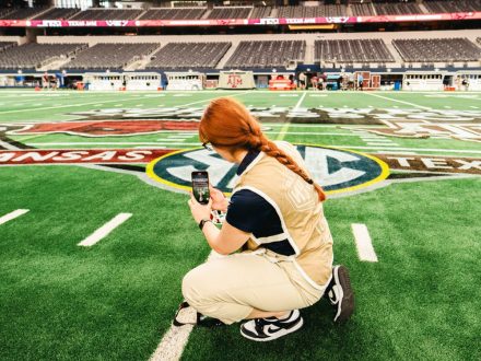 Rachel Mikolay ’23 on NCAA football field.