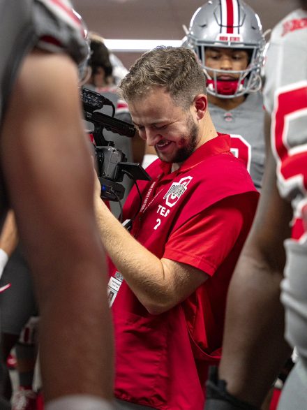 Elon University alumnus Peter Fortunato ’21 with Ohio State football.