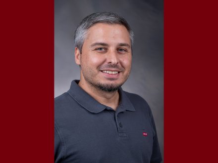 Headshot of Kerem Morgul on maroon background