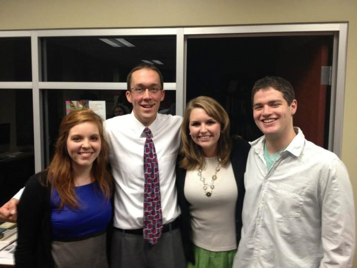 Four people pose in a photo