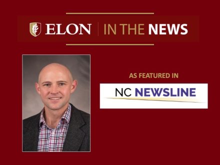 Red graphic reading “Elon in the News” with a headshot of a smiling bald man in a blazer and plaid shirt, alongside the text “As featured in NC Newsline” and the NC Newsline logo.