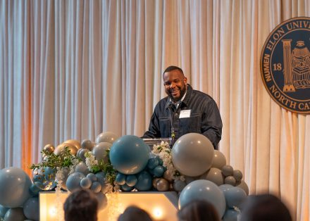 Miles Williams ’15 giving his acceptance speech at the 2025 Top 10 Under 10 Alumni Awards Ceremony on the campus of Elon University
