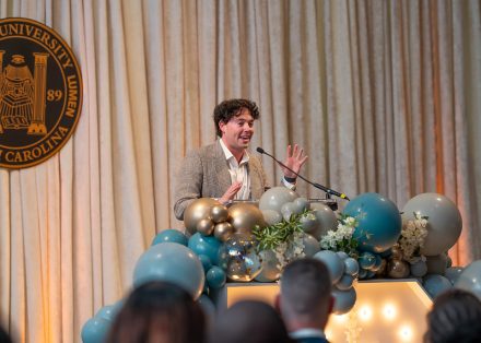 JJ Niemann ’17 giving his acceptance speech at the 2025 Top 10 Under 10 Alumni Awards Ceremony on the campus of Elon University