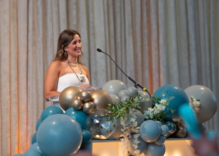 Dr. Erica Braschi Jordán ’18 giving her acceptance speech at the 2025 Top 10 Under 10 Alumni Awards Ceremony on the campus of Elon University