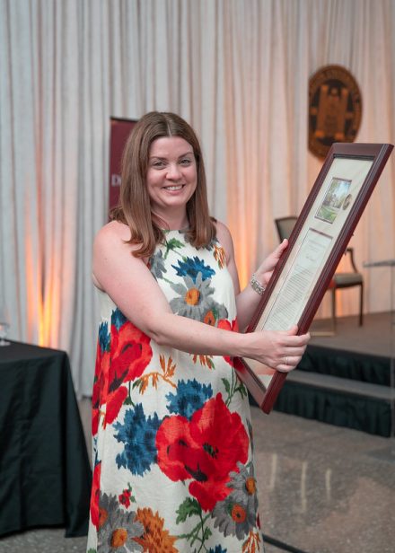 Cecelia Thompson ’05, a recipient of the 2025 Distinguished Alumni Awards, poses with his award after the ceremony on the Elon University campus