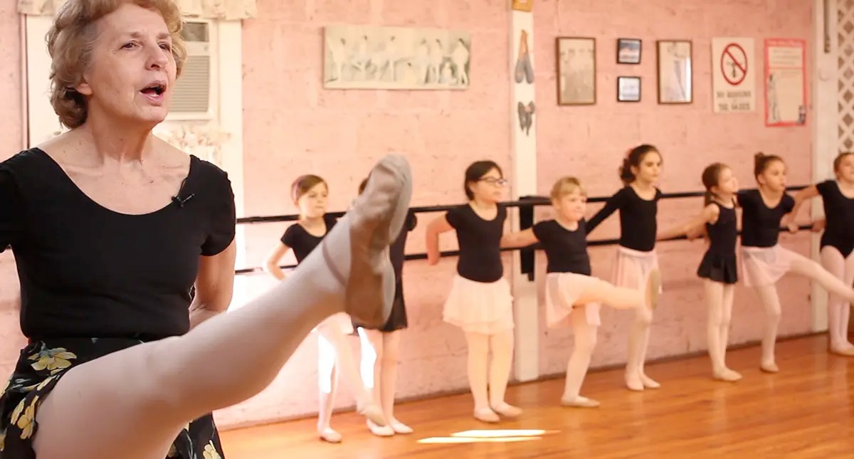 Joyce Triche dances with students.