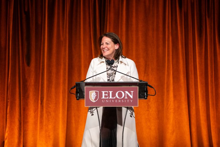 President Connie Ledoux Book speaks at a podium