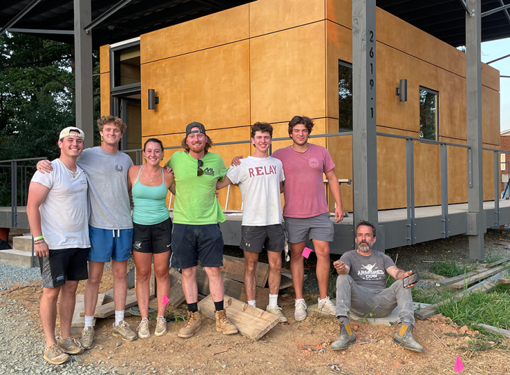 Macey Rodrigues-Cowl '25 with crew that built house in EcoVillage