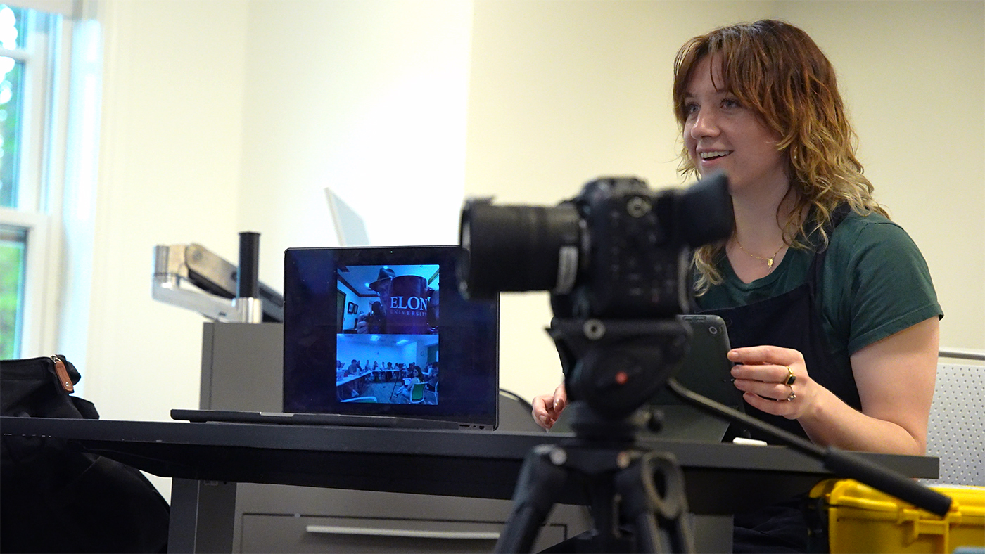 Elon professor Kai Swanson addresses class with Dan Mirvish joining via video.