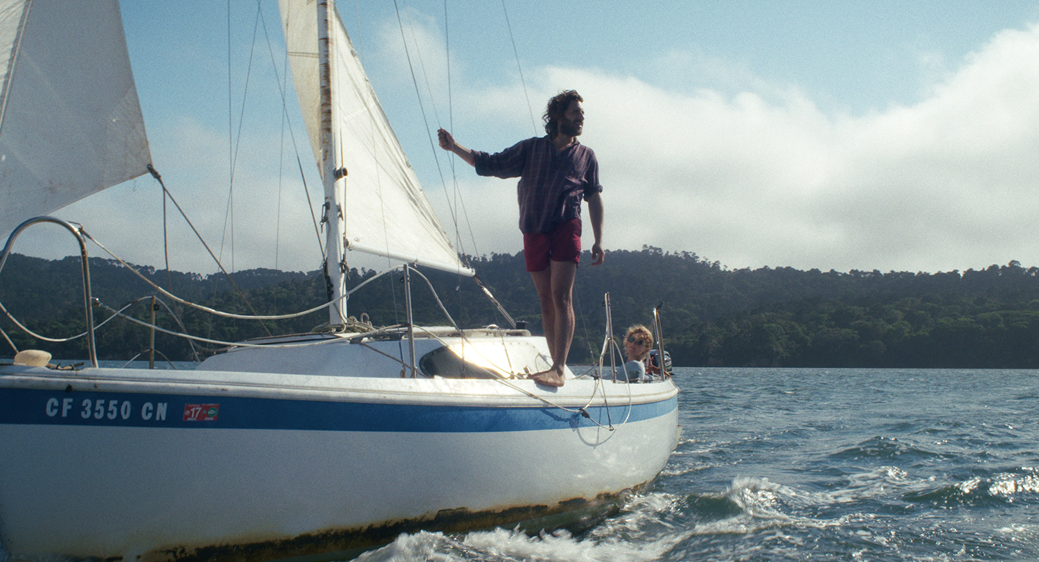 John Giacobbe stands upon a sailing boat