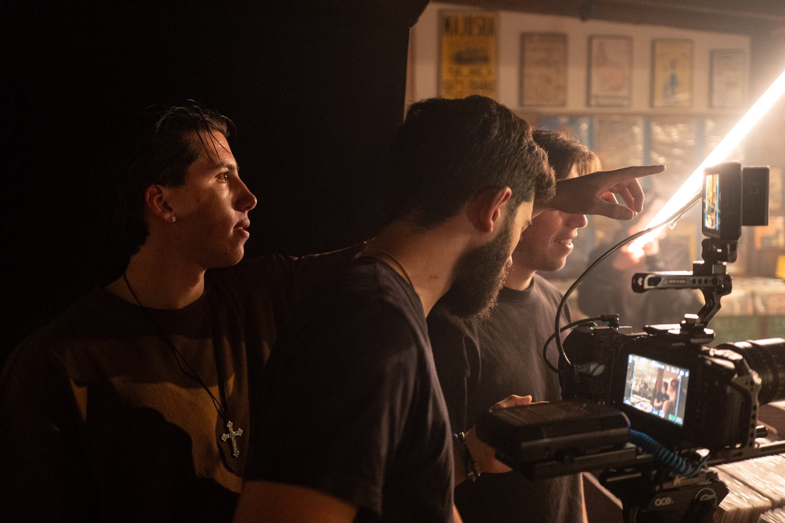 Liam works with others on set for one of his film projects, behind the camera.