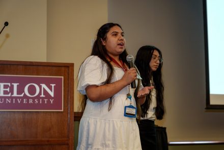 Freedom Scholar Yarlie Jimenez Cuevas, an M. Cummings High School graduate, presents her group's research focused on expanding opportunities for every student