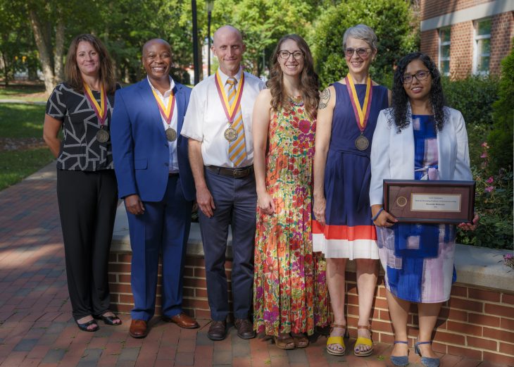 Six Elon University faculty members were awarded endowed professorships during the Opening Day ceremony on Aug. 18. 2025. Left to right: Cassandra DiRienzo, professor and department chair of economics; Titch Madzima, associate professor and chair of exercise science; Dave Gammon, professor of biology; Nancy Scherich, assistant professor of mathematics and statistics; Lauren Kearns, professor of dance; Smaraki Mohanty, assistant professor of marketing