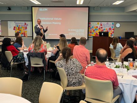 Elon's Patrick Noltemeyer addresses staff members.
