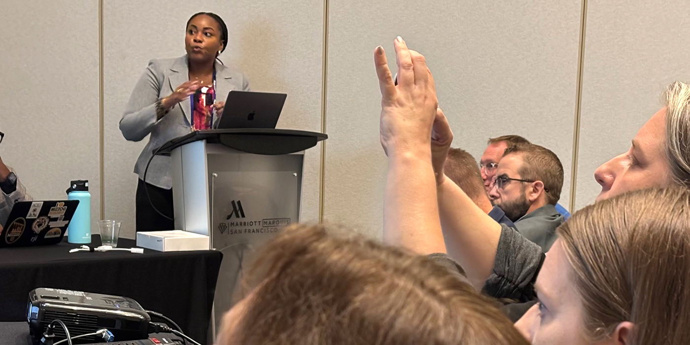 Shanetta Pendleton of Elon University speaks at AEJMC conference.