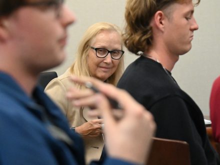 Assistant Professor Lorraine Ahearn looks at her Elon students.