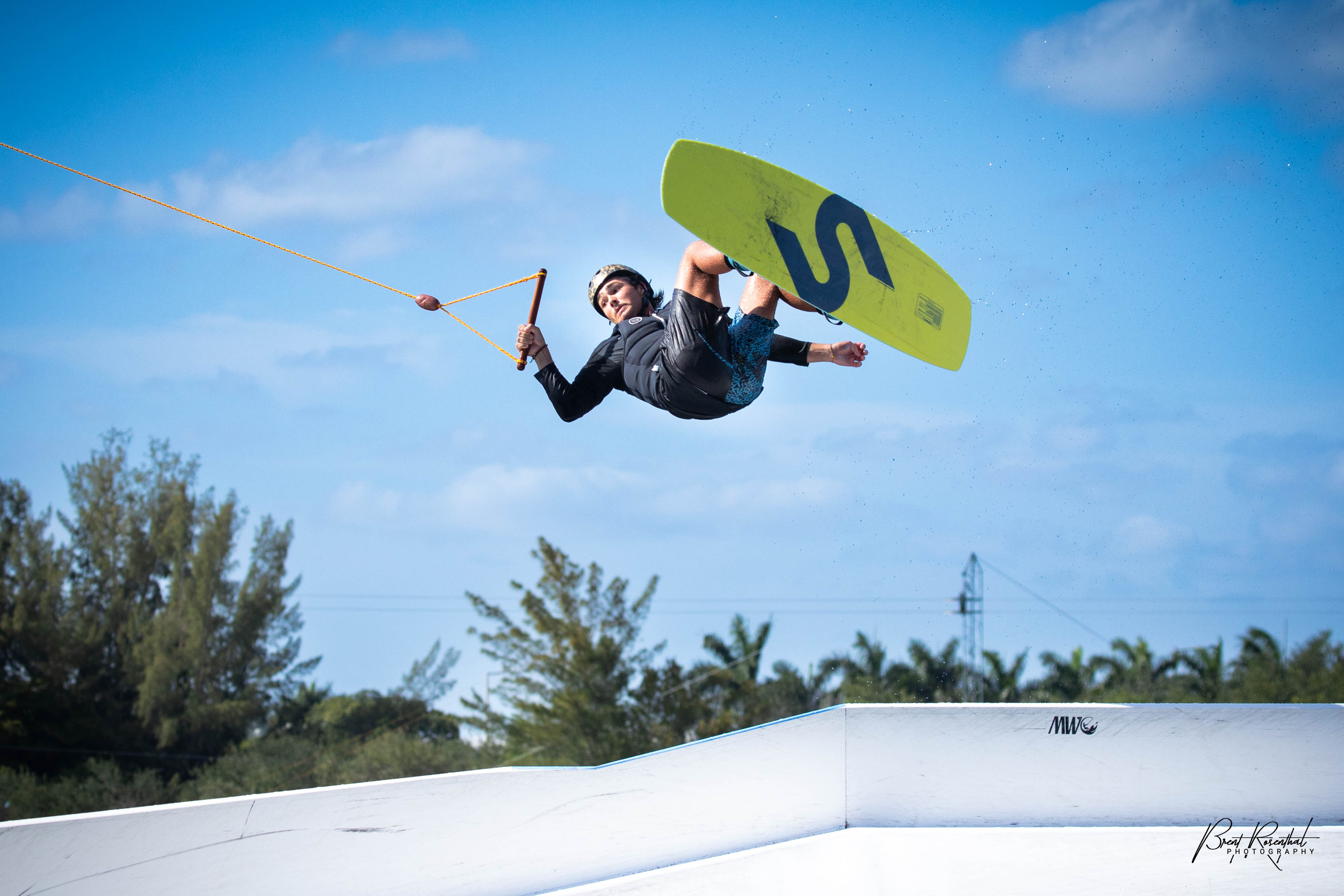 A person is in the air while wakeboarding