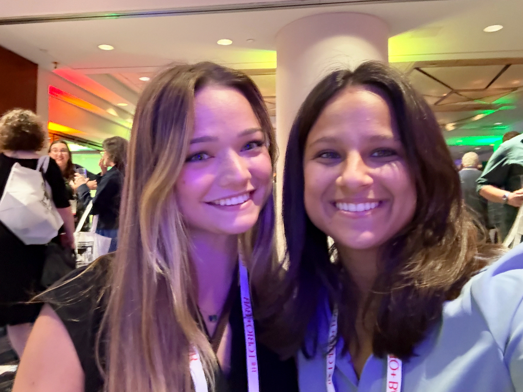 Two women smiling, posed for a selfie
