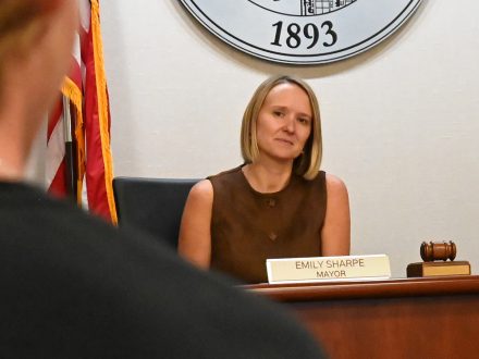 Elon Mayor Emily Sharpe listens to Elon student.